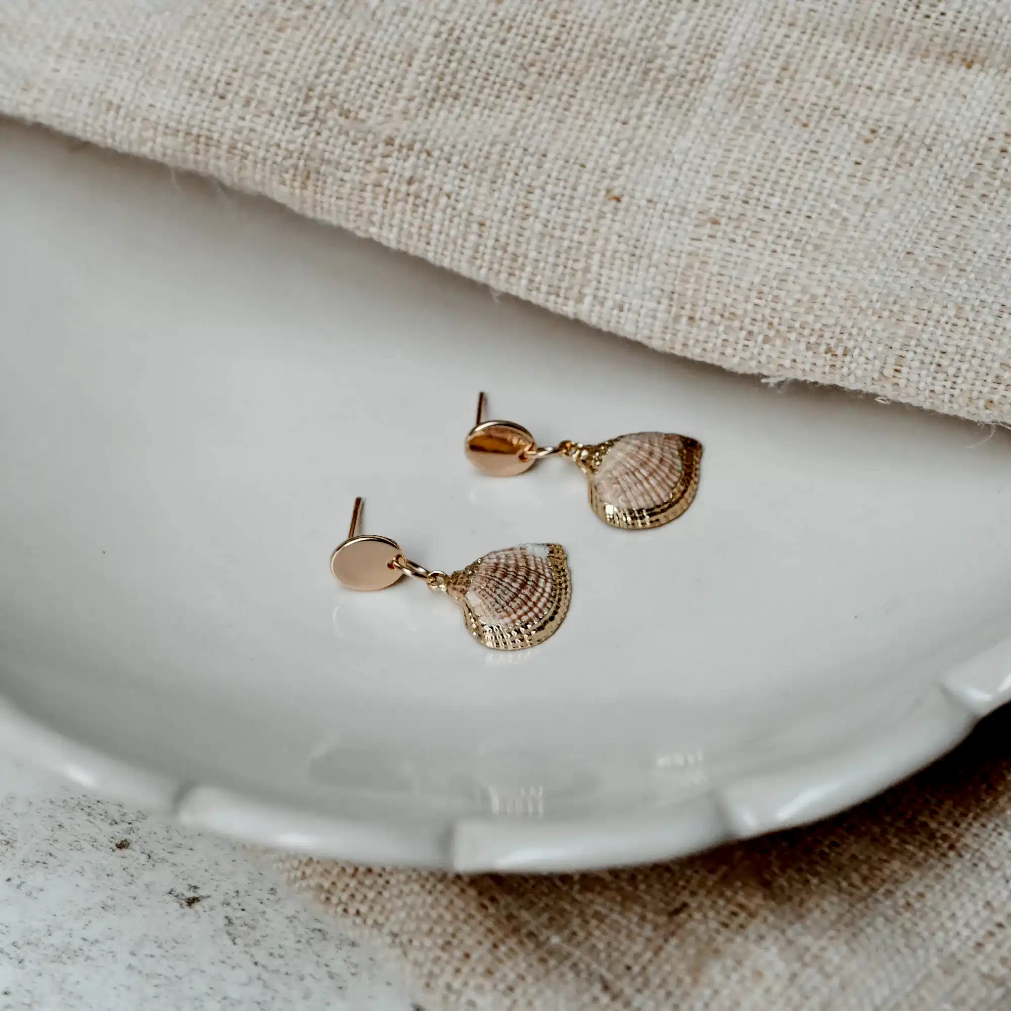 Cosmos Studio by Botanique Workshop natural and golden shell earrings